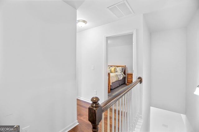 hallway featuring hardwood / wood-style floors