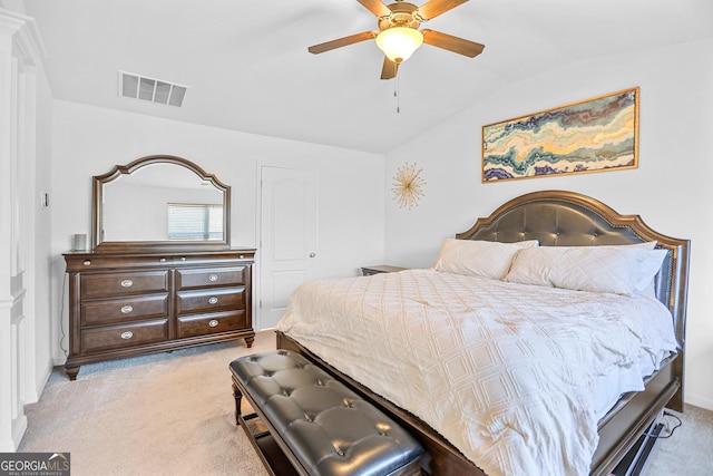 bedroom featuring ceiling fan, light colored carpet, and lofted ceiling