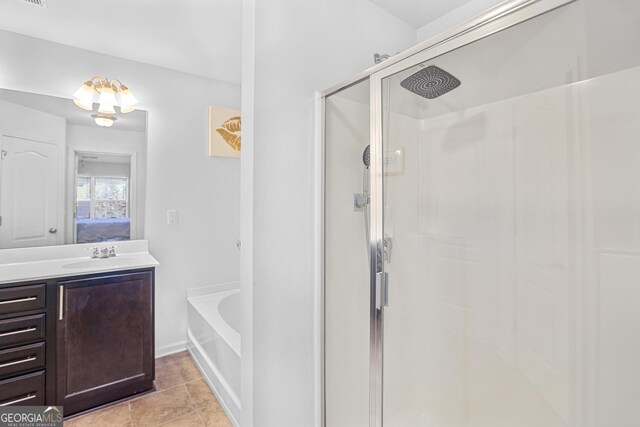 bathroom with independent shower and bath, tile patterned flooring, and vanity