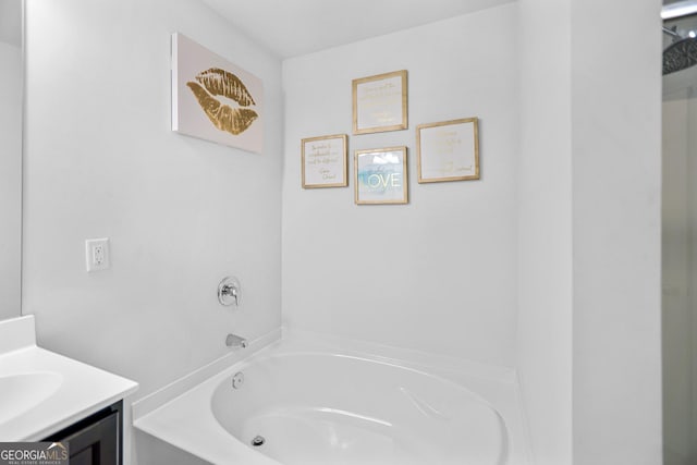 bathroom featuring vanity and a bathtub