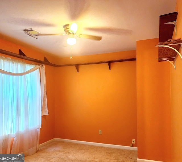 carpeted empty room with ceiling fan