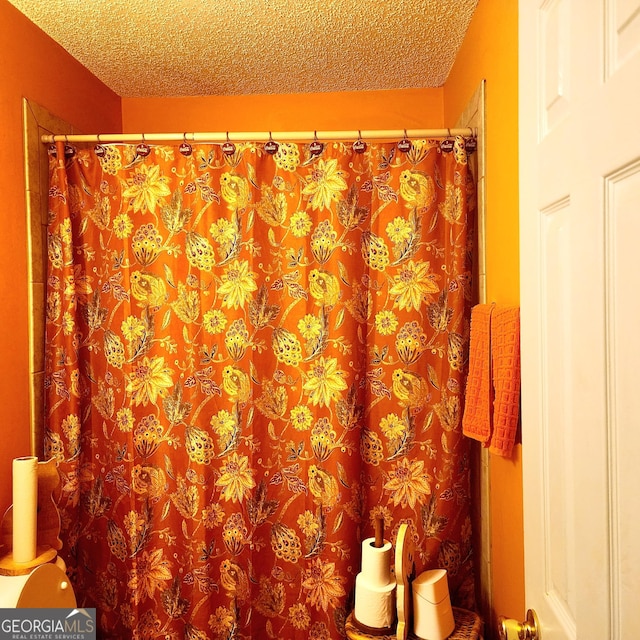 bathroom with a textured ceiling