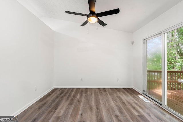 spare room with ceiling fan, lofted ceiling, and hardwood / wood-style floors