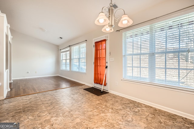 entryway featuring a chandelier, lofted ceiling, visible vents, and baseboards