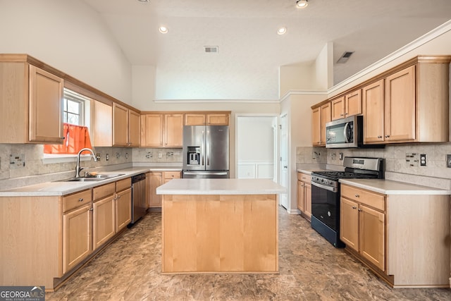 kitchen featuring appliances with stainless steel finishes, a kitchen island, light brown cabinets, sink, and high vaulted ceiling