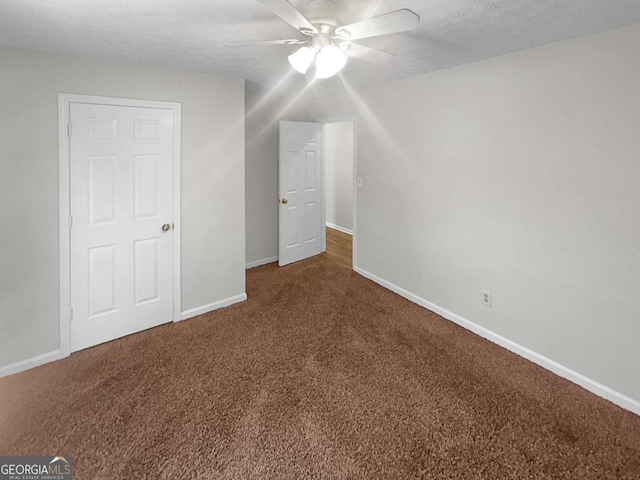 bonus room with carpet, ceiling fan, and a textured ceiling