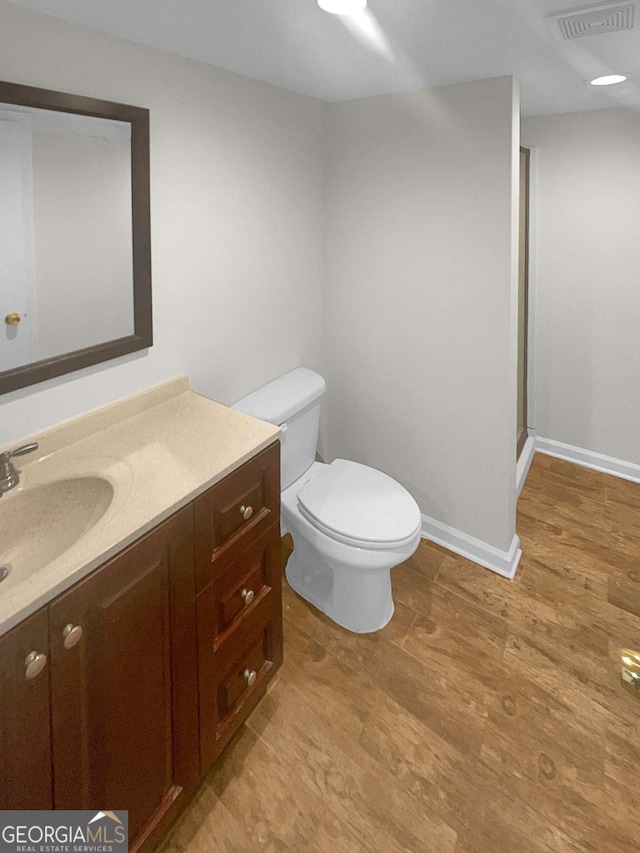 bathroom with toilet and vanity