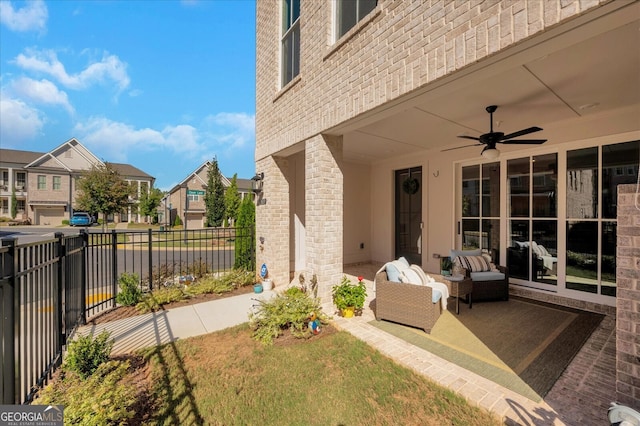 view of patio with ceiling fan and outdoor lounge area