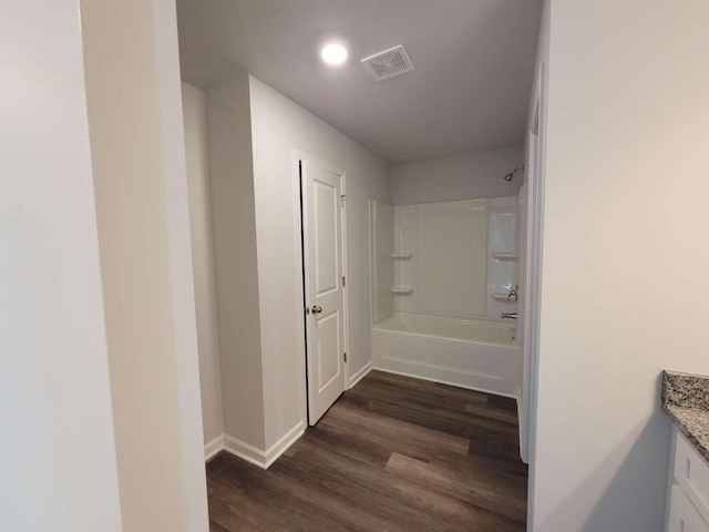 corridor with dark hardwood / wood-style floors