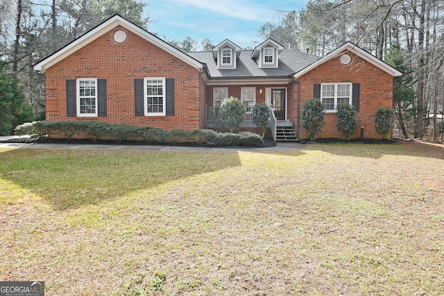 view of front of house with a front yard and a porch