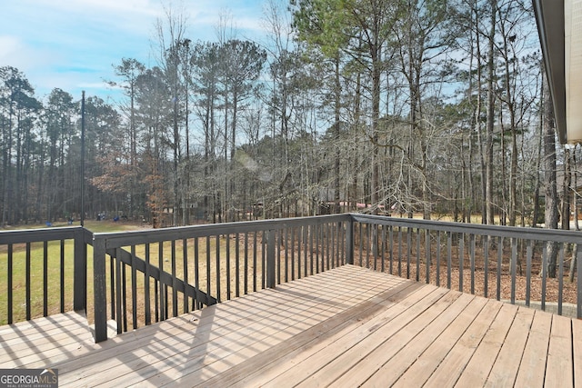 wooden terrace with a lawn