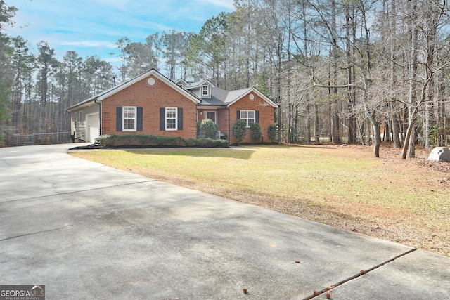 ranch-style house featuring a garage and a front yard