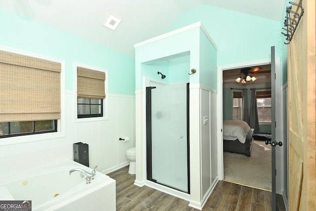 bathroom with toilet, independent shower and bath, wood-type flooring, and ceiling fan