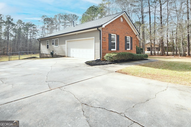 view of property exterior featuring a garage