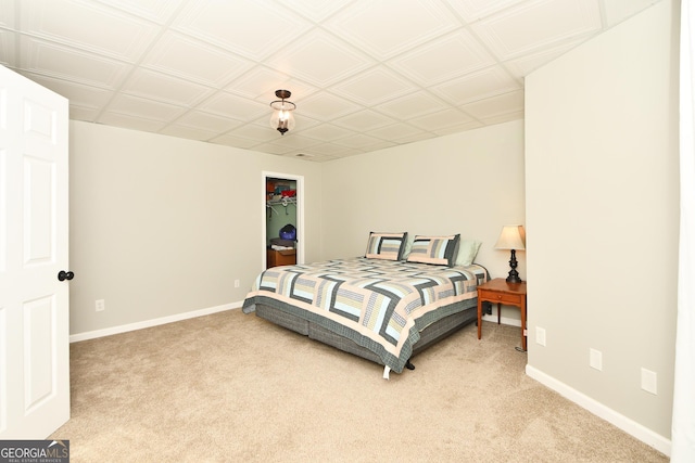 bedroom with carpet and a closet