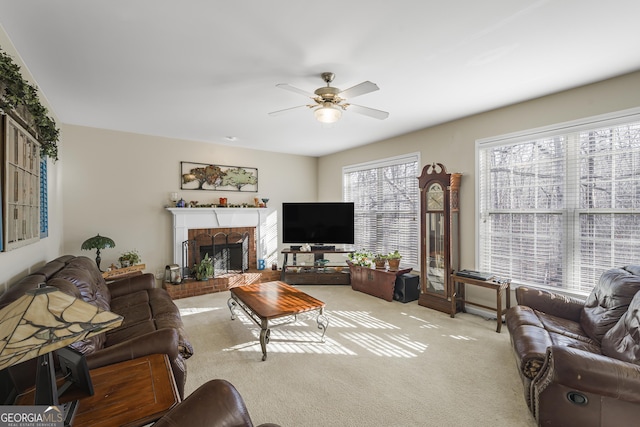 carpeted living room with ceiling fan