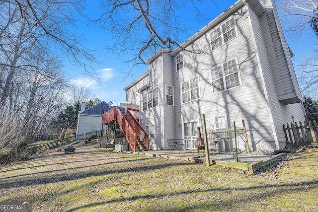 back of property featuring a yard and a patio area