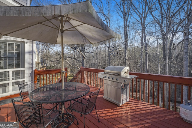 wooden terrace featuring grilling area