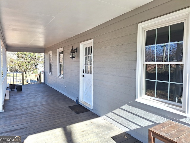 wooden terrace with a porch