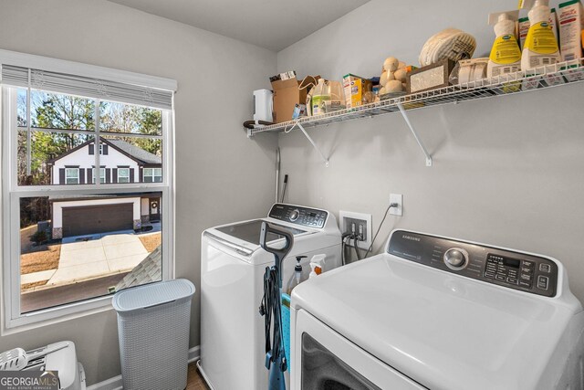 laundry room with separate washer and dryer