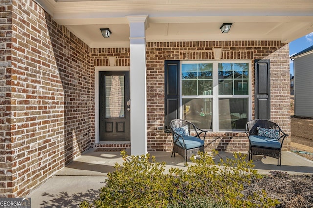 entrance to property featuring a porch