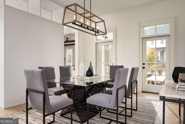 dining area featuring light wood-type flooring