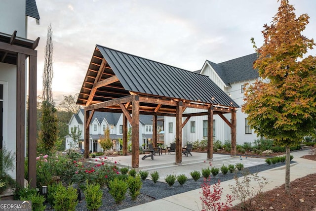 view of community featuring a gazebo, a patio area, and a residential view