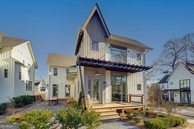 rear view of house featuring a pergola