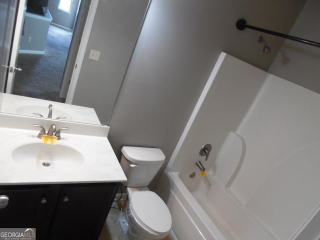 full bathroom featuring vanity, toilet, and washtub / shower combination