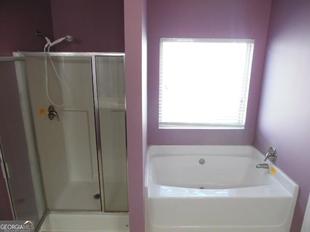 bathroom with independent shower and bath