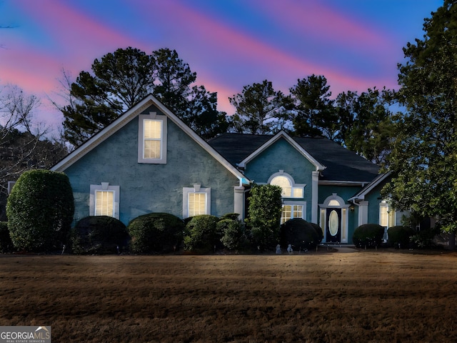 view of front of house with a yard