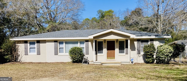 ranch-style home with a front yard