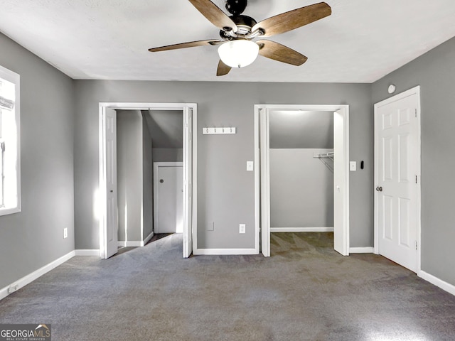 unfurnished bedroom with ceiling fan and carpet flooring