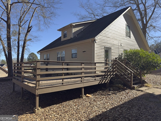 view of side of home with a deck