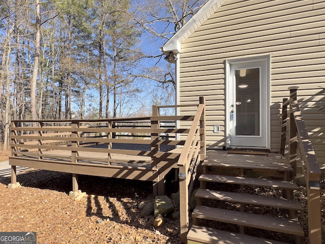 view of exterior entry featuring a deck