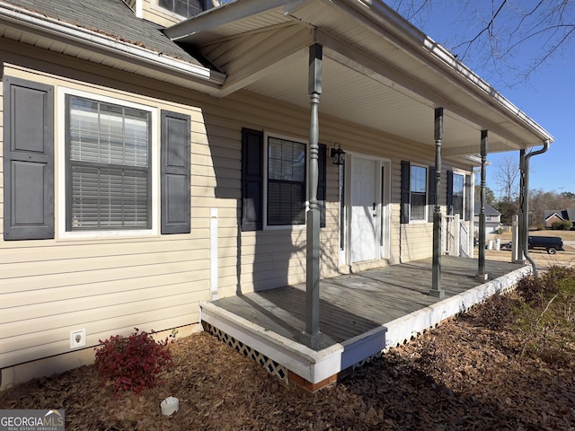 wooden terrace featuring a porch