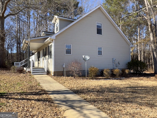 view of property exterior with a porch