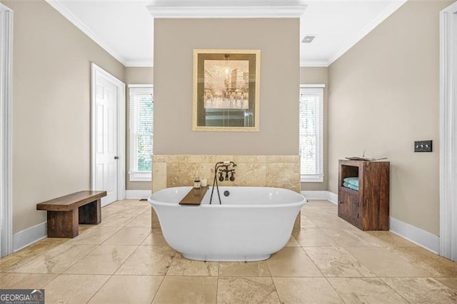 bathroom with a washtub and crown molding