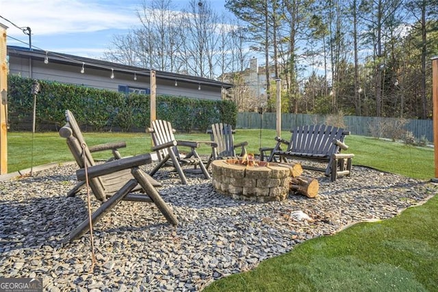 view of yard with a fire pit