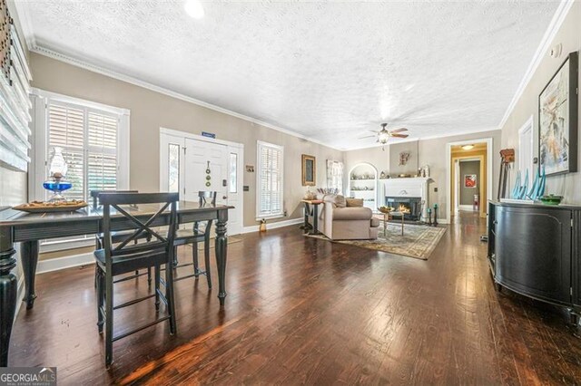 kitchen featuring white cabinetry, sink, dark hardwood / wood-style floors, and a kitchen bar