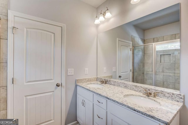 bathroom with an enclosed shower and vanity