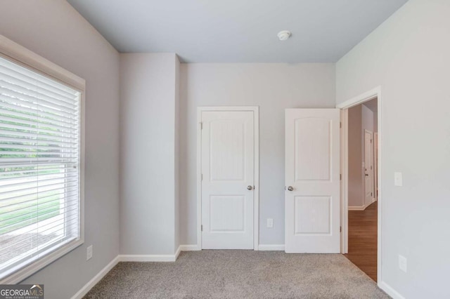 unfurnished bedroom with carpet floors