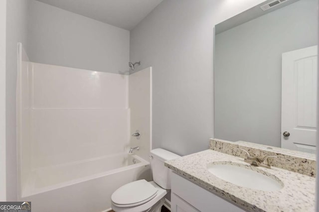 full bathroom with toilet, vanity, and shower / bathtub combination