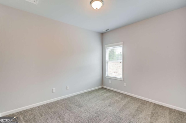 unfurnished room featuring carpet flooring