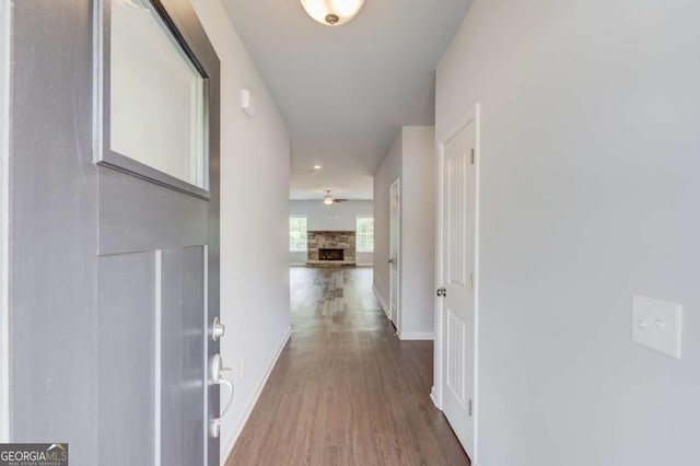 hall with hardwood / wood-style flooring