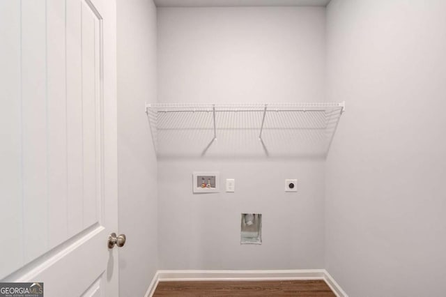 laundry room featuring dark hardwood / wood-style floors, hookup for an electric dryer, and hookup for a washing machine