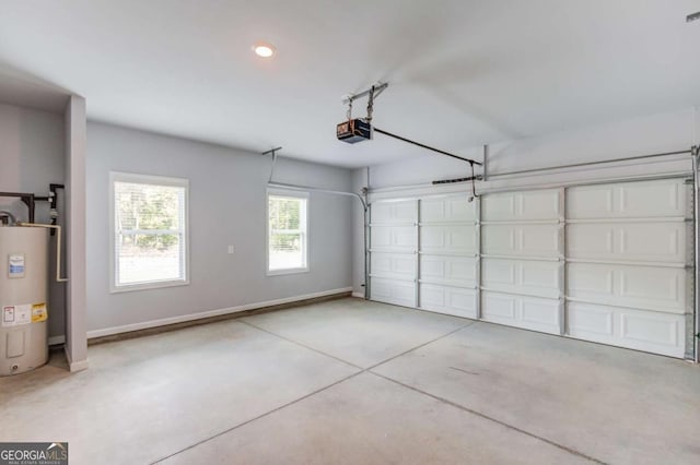 garage with electric water heater and a garage door opener