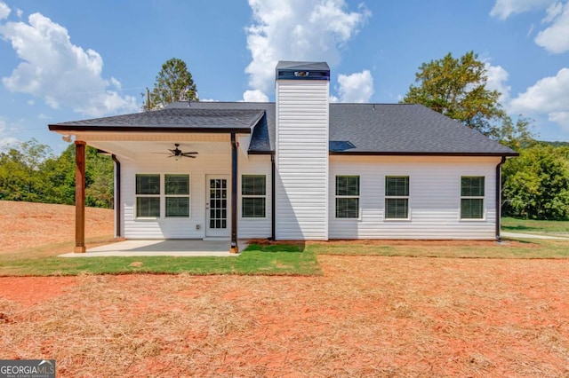 rear view of property with ceiling fan and a patio