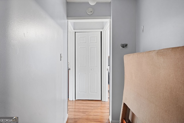 corridor featuring light hardwood / wood-style floors