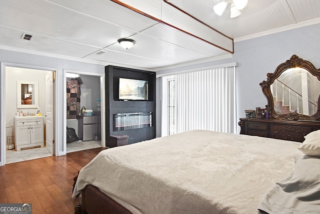 bedroom featuring ensuite bathroom, ceiling fan, ornamental molding, and hardwood / wood-style flooring